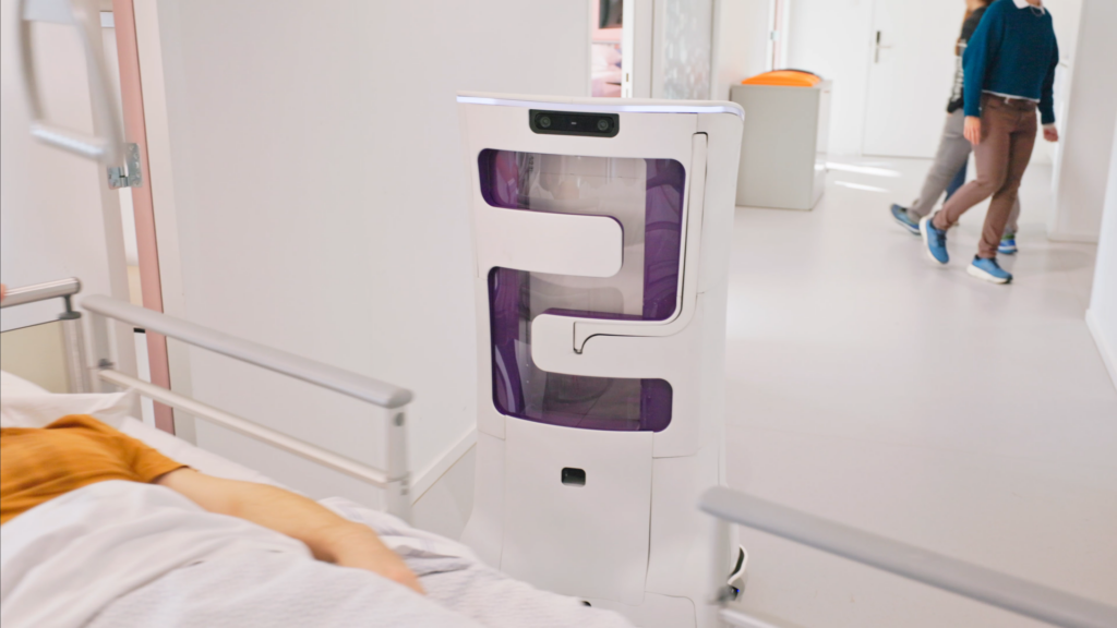 Autonomous care robot navigating a hospital corridor while sensing and responding to its surroundings