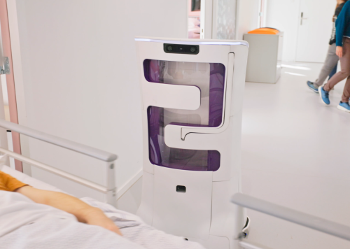Autonomous care robot navigating a hospital corridor while sensing and responding to its surroundings